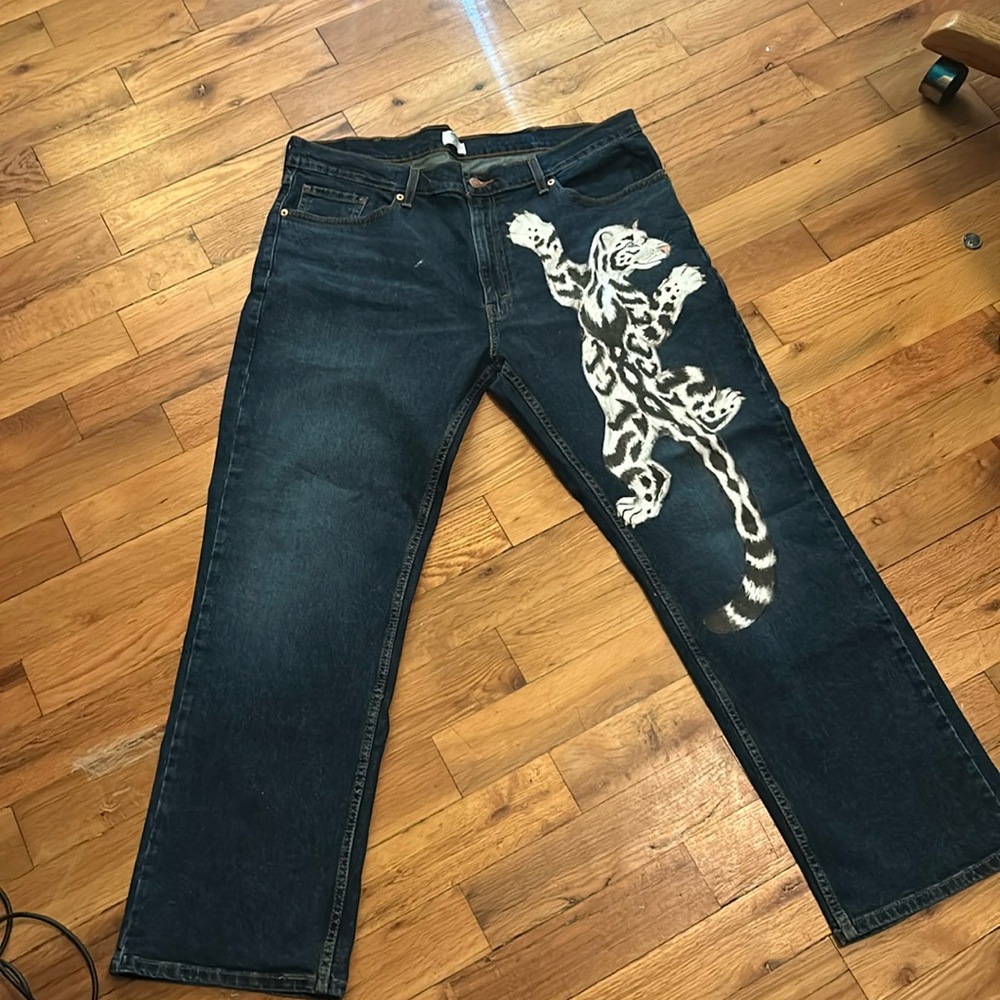 Custom-made, snow leopard painting dark washed jeans. 1 of 1
